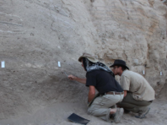 Jay Quade (left) and Jordan Abell, a postdoctoral associate in the Department of Geosciences (right) looking for optimal samples.