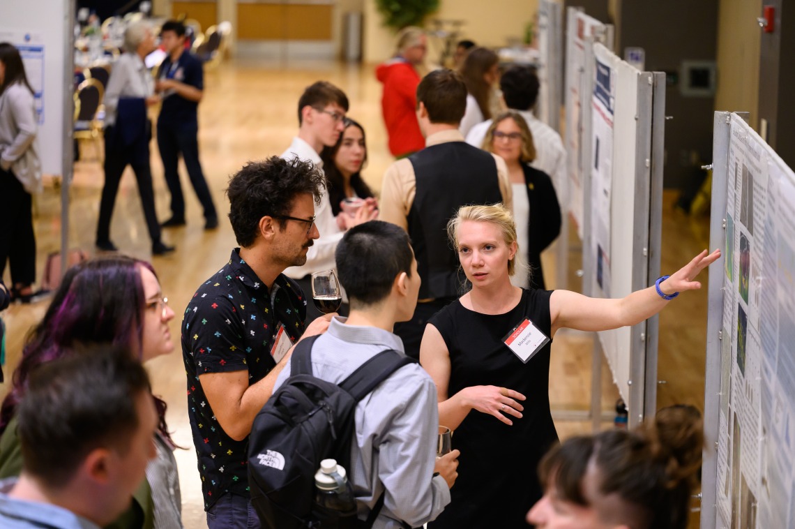 Galileo Circle Scholars display and explain research during poster session in Student Union Ballroom.